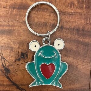 Vintage 1990s Adorable Cartoon Frog Metal Keychain. Cute frog holding a heart.